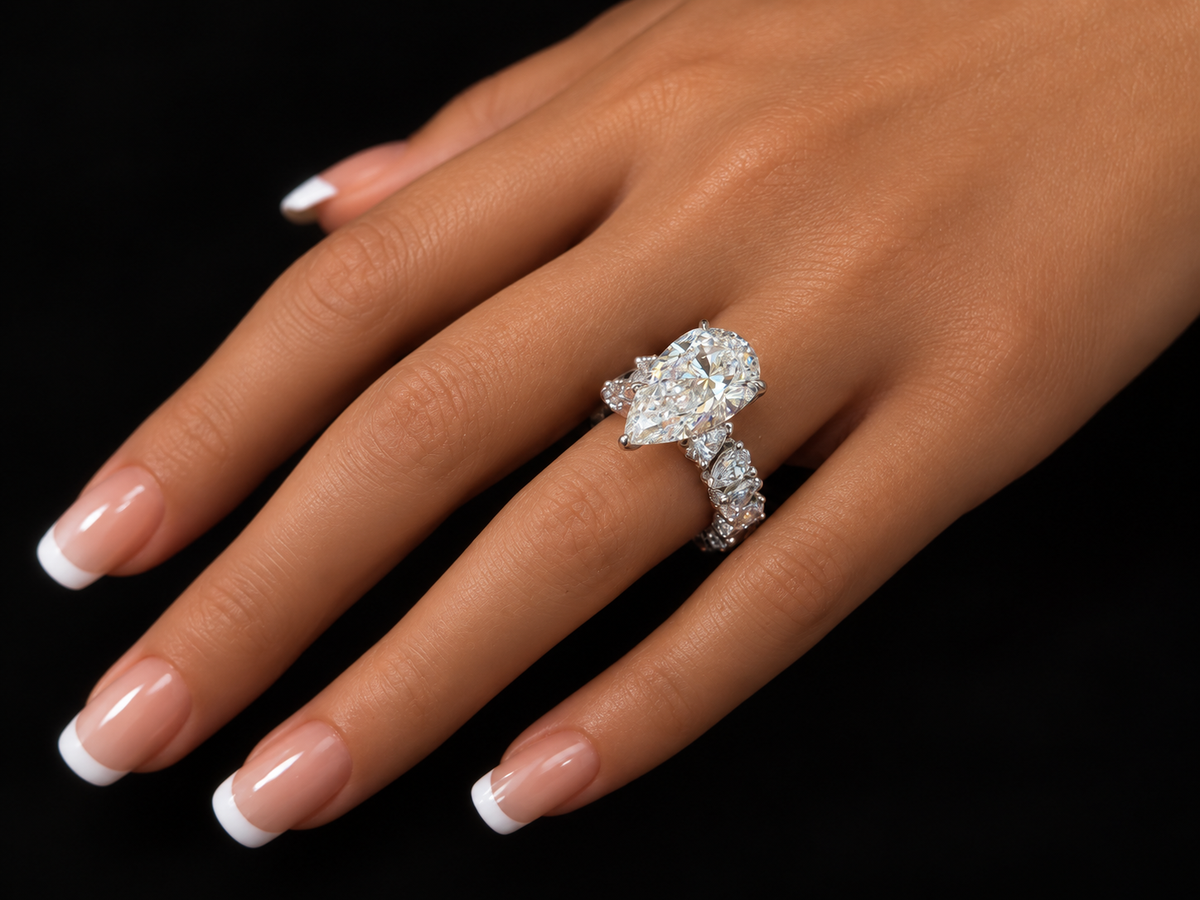 Extravaganza 7.00 Carat Pear-Shaped Diamond Engagement Ring with Eternity-Style Band