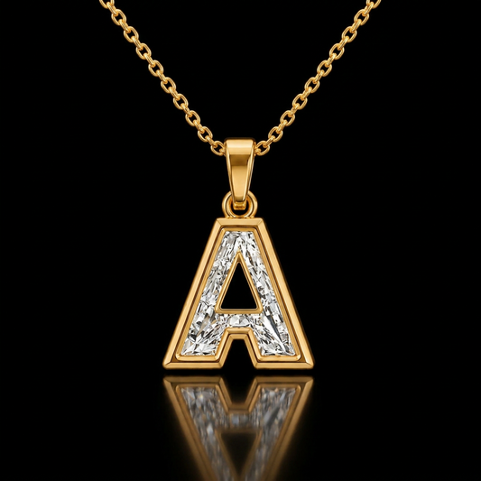 Initial A baguette lab-grown diamond pendant necklace in 14K yellow gold on its cable chain, black background